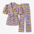 Conjunto Solara con mangas abullonadas y estampado abstracto violeta y amarillo