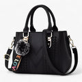 Bolso bandolera negro para mujer de piel auténtica con correa ajustable y pompón
