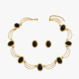 Ketting en oorbellen met koninklijke hanger in retrostijl  