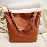 Nova - leren tas met knoopsluiting en extra ruimte voor dames